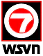 Logo featuring a red number 7 inside a white circle with a red border, set on a black square background.